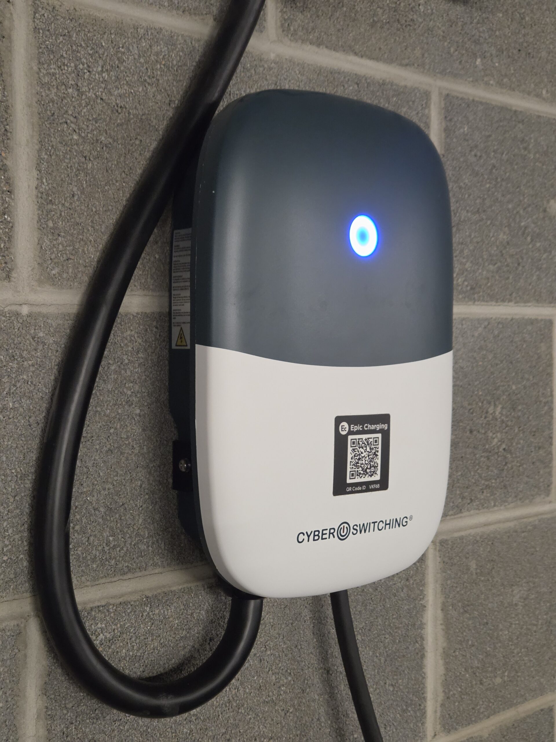 A Rivian R1S charging at RiverView Condos via CyberSwitching CSE1 Level 2 station