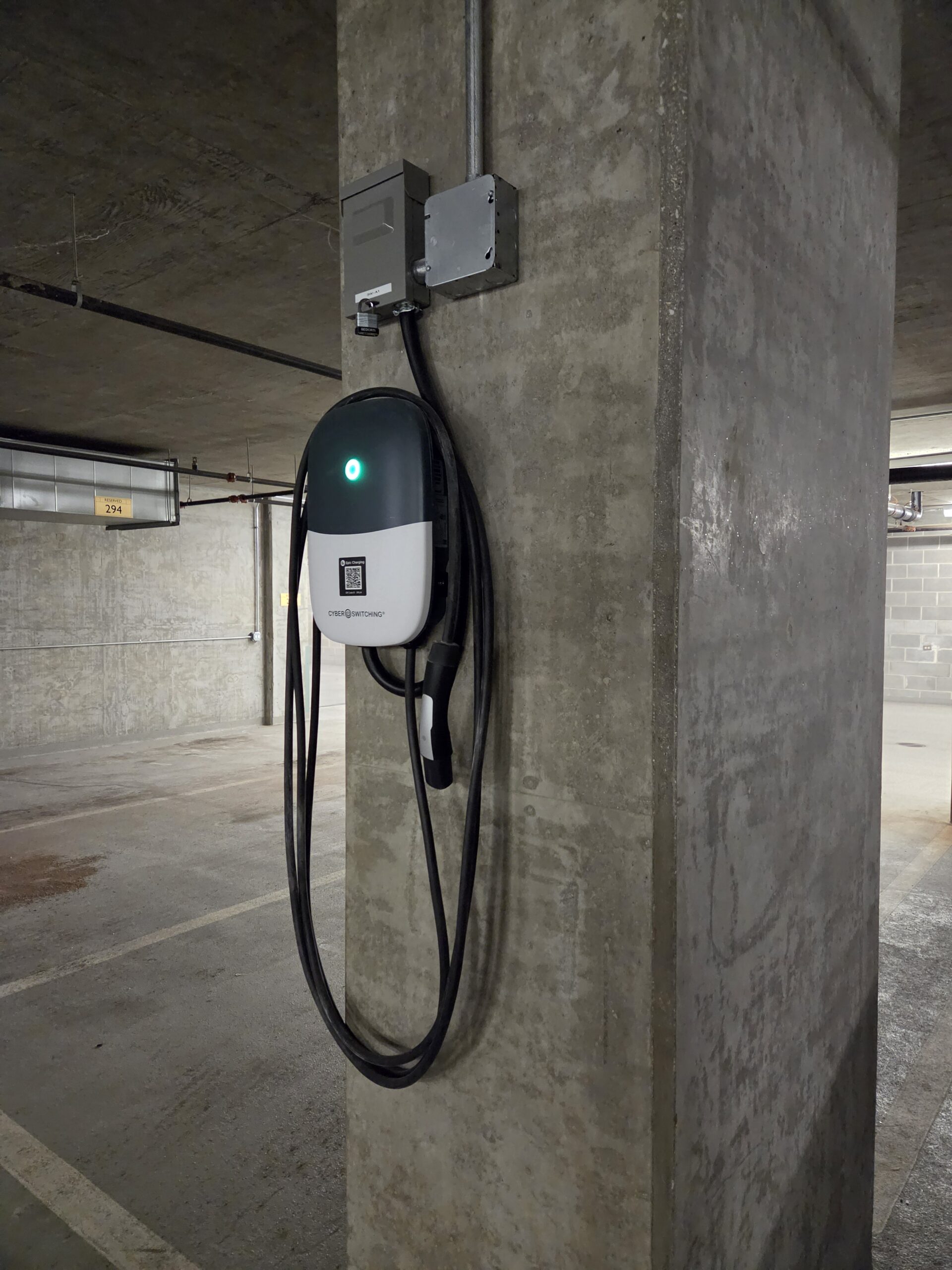 CyberSwitching CSE1 Level 2 charger with 25-foot cable in the RiverView Condos garage